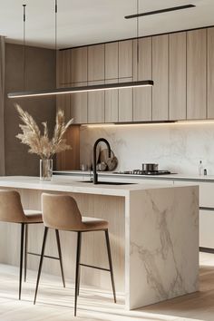 a kitchen with marble counter tops and wooden stools next to an island in the middle