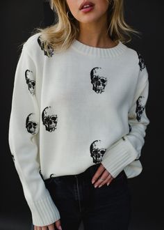 Cream knit sweater Black skull designs on the front and back Long sleeves Relaxed fit Imported garment 100% Acrylic SIZE CHARTS: Bust: 40" / Length: 22"M: Bust: 42" / Length: 23"L: Bust: 44" / Length: 24"XL: Bust 46" / Length: 25" Skull Designs, Fall Sweaters For Women, Brown Knit Sweater, Skull Sweater, Cream Knit Sweater, Cozy Knit Sweater, Halloween Sweater, Blouse Tank Top, Black Skull