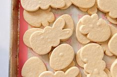 some cut out cookies are sitting on a baking sheet