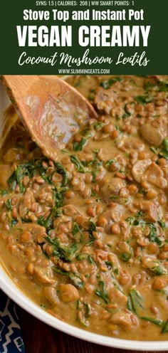 a white bowl filled with vegan cream and beans on top of a wooden table