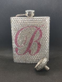 a flask with a monogrammed initials on it