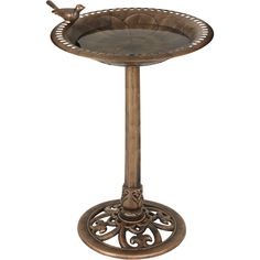 an ornate metal tray with a bird sitting on it's top and bottom shelf