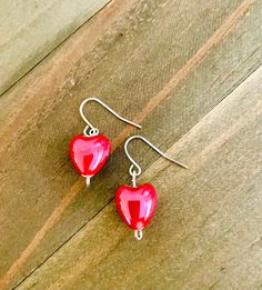 These dainty red ceramic heart earrings are very dainty and classic.  They are just in time for Valentine's Day!  They are cute and small at about 1 inch in length.  They definitely are for anyone that loves small earrings.  The red ceramic lovlies are very light on the ears.   ~I use high quality hypoallergenic materials along with many different colors and types of beads and charms.  I work hard to create beautiful pieces and to provide excellent customer service.   They come on a lovely earring card and are placed in a white drawstring organza bag. Your package will include a thank you card with my deepest appreciation to all customers. Other metal earrings in the shop: https://www.etsy.com/shop/ValsJewelrySpot?load_webview=1&bid=l1H_tgWpczxPIb4cpQERV3KmWE5L&section_id=35887021 Valentines Day Jewelry, Bead Heart, Gold Filigree Earrings, Boho Hoop Earrings, Red Heart Earrings, Gold Heart Earring, Dangle Earrings Boho, Red Ceramic, Ceramic Heart