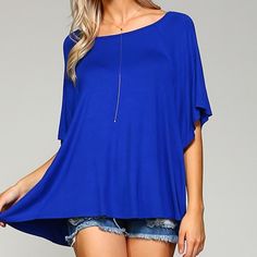 This Swing Tunic - In A Gorgeous, Universally-Flattering Cobalt Blue - Will Quickly Become A Favorite. Features Dolman Sleeves And The Perfect Swingy, Oversize Fit. Equally Fab With Jeans Or A Skirt, You'll Want This Baby In Every Color! Solid Cobalt Swing Tee. Dolman/Batwing Sleeves Hit At Elbow. Made In The Usa. 95% Rayon Jersey/5% Spandex. Boxy Cut, Though Still True To Size. If You Would Prefer A Slimmer Fit, Size Down One. Blue Solid Color Crew Neck Blouse, Oversized Blue Solid Color Top, Oversized Solid Blue Top, Blue Summer Blouse With Batwing Sleeves, Blue Batwing Sleeve Blouse For Summer, Blue Batwing Sleeve Blouse For Spring, Blue Batwing Sleeve Summer Tops, Casual Blue Blouse With Batwing Sleeves, Casual Blue Batwing Sleeve Blouse