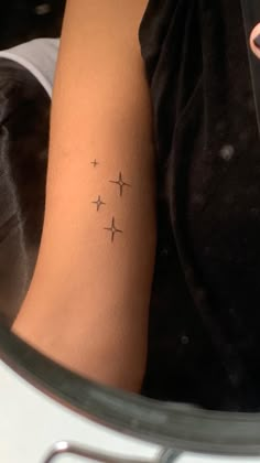 a person with a small tattoo on their arm