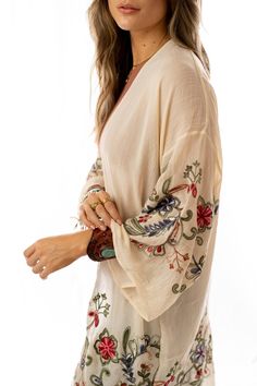 Nothing is more fun than a kimono covered in floral! This perfect layering piece features a sheer fabric in a longline silhouette with accents of crochet florals in multicolors along the hem and wide sleeves.Model is 5'8" and wearing one size.100% Polyester, Imported. OS sizing fits most* sizes US 0-18Length: 38 inBust Across: 25 inSleeve Length: 17 inSleeve Opening: 11 in Embroidered Summer Dress, Three Bird Nest, White Bralette, Beautiful Kimonos, Rust Dress, Color Block Top, Floral Kimono, Green Midi Dress, Bird Nest