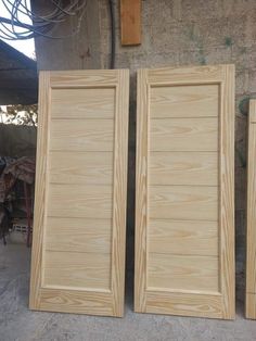 two wooden doors sitting next to each other