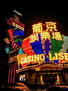 a casino sign lit up at night with neon lights