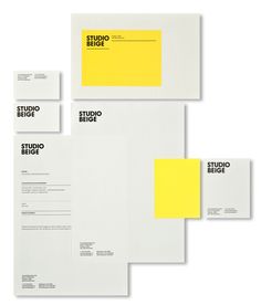 three sheets of white paper with yellow and black letters