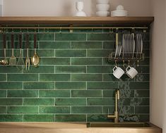 a green tile backsplash in a kitchen