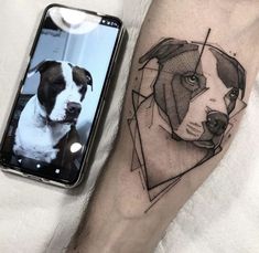 a dog's face on the arm next to a cell phone and a photo