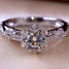 an engagement ring is shown with diamonds on it