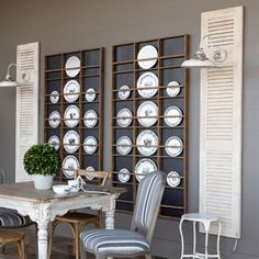 the dining room is decorated in white and gray