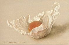 an orange in a white wrapper on top of a table