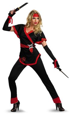 a woman dressed in black and red holding two swords