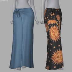 two female mannequins wearing long skirts with sun and moon designs on them