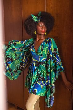 A cross-cultural symbol of transformation, rebirth, change and hope is brought to life with vibrant shades of blues, greens and pops of lime in Psychedelic Butterflies. Bohemian dreams are fashioned with angel sleeves, embroidery and lusciously draped caftans in this late 60s printed rayon crepe de chine! Our Butterfly Mini Dress is made for DRAMA! Based on the popular Deep Cut Doris style- this one is shorter and with ruffled ANGEL sleeves to below the skirt hem! Pockets Side Zip Fitted & Topst 1970s Hippie Fashion, Crazy Dresses, Sleeves Embroidery, Austin Powers, Angel Sleeves, Birthday Shoot, Angel Sleeve, Clothing And Textile, Antique Clothing