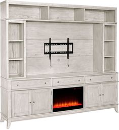 a white entertainment center with a fire place