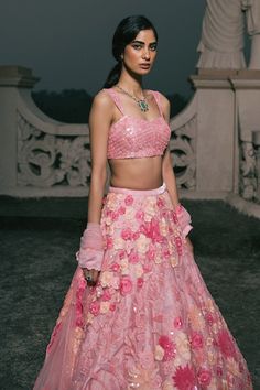 Peach pink attached cancan lehenga with all over floral embroidery using sequins, crystals. Paired with a padded blouse with all over sequins, crystal work and matching dupatta. - Aza Fashions Fitted Pink Gown For Ceremony, Pink Fitted Lehenga For Wedding, Fitted Pink Choli For Reception, Fitted Pink Sets For Ceremony, Pink Lehenga With Resham Embroidery For Ceremony, Pink Sharara With Resham Embroidery For Ceremony, Pink Fitted Lehenga For Reception, Pink Resham Embroidery Ceremony Sets, Pink Resham Embroidery Sets For Ceremony