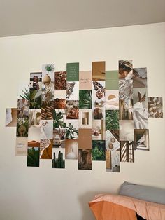 a collage of photos hanging on the wall next to a bed with an orange pillow