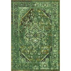 a green rug with an ornate design