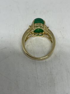 Vintage Lucky Green Nephrite Jade Gold Filled Cocktail Ring Large green nephrite jade gold filled Vintage ring, does not tarnish Size 5.5, 6, 7, 7.5, 8 All rings are shipped free in the US in a nice gift box. Check out our over a THOUSAND great reviews Engraving is $4 per letter and is not always perfect depending on the piece. It can take a few days if the jeweler is busy. This is payable to Paypal Judithsltd@gmail.com Fine Jewelry Jade Ring For May Birthstone, Formal Gold Jade Rings, Green Oval Opal Ring For Promise, Green Oval Opal Promise Ring, Fine Jewelry Gold Rings With Jade, Green Emerald Oval Cabochon Ring Stamped 14k, Green 14k Stamped Round Rings, Gold Jade Rings In Fine Jewelry Style, Green 14k Stamped Ring