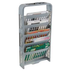 a magazine rack with magazines and other items in it on a white background for display