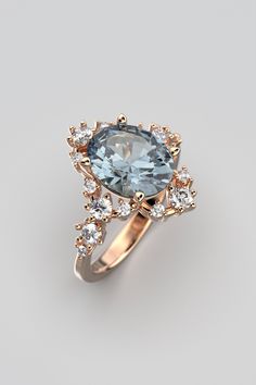 Enhance your romantic narrative with our exquisite Engagement Ring featuring a Natural Aquamarine and Diamonds, meticulously crafted by Oltremare Gioielli in Italy. This enduring piece highlights a dazzling oval-shaped aquamarine, approximately 2.3 carats, boasting a captivating light blue hue. The aquamarine, measuring 10 x 8 x 5.2mm, ensures a captivating presence on the finger. At the heart of the design, the aquamarine takes center stage, embraced by a halo of diamonds totaling around 0.48 carats. These diamonds not only accentuate the brilliance of the aquamarine but also add an extra layer of sophistication and sparkle to the ring. Each ring is tailored to your preferences, allowing for customization of this symbol of your love. Opt for 14k or 18k solid gold in white, rose, or yellow Luxury Rose Gold Topaz Ring For Wedding, Elegant Rose Gold Diamond Ring With Accent Stones, Elegant Rose Gold Topaz Ring With Accent Stones, Luxury Brilliant Cut Topaz Ring For Wedding, Elegant Cushion Cut Topaz Ring For Wedding, Luxury Topaz Ring With Halo Setting For Wedding, Luxury Topaz Wedding Ring With Halo Setting, Exquisite Brilliant Cut Topaz Ring For Wedding, Luxury Wedding Topaz Ring With Halo Setting