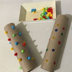 two rolls of paper with colorful candy on them