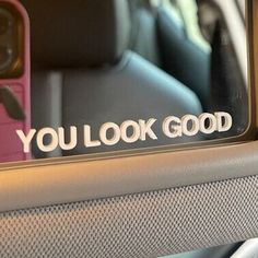 you look good sticker on the back window of a car with its door open