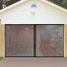 a woman standing in front of a garage door with the screen pulled open to allow privacy