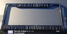 an aluminum license plate frame with the words fisk university on it