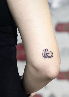 a woman with a small tattoo on her arm