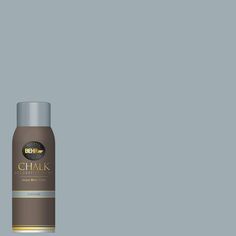 a bottle of deodorant on a gray background with the words chalk written in gold