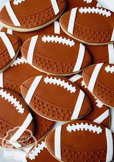 cookies decorated with footballs are arranged on a plate