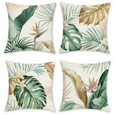 four pillows with tropical leaves on them