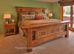 a bed room with a neatly made bed and sliding glass doors