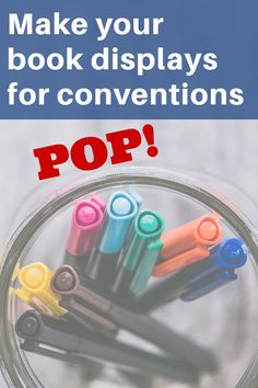 a jar filled with colorful markers and the words make your book displays for convention pop