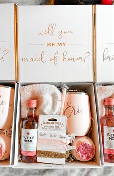 three bottles of booze and some other items in a box with writing on them