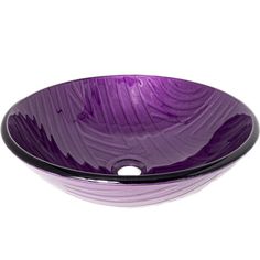 a purple glass bowl sink on a white surface with wavy lines in the bottom and black rim