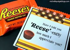 two reese's candy bars are sitting next to each other on a black surface