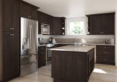 a kitchen with brown cabinets and stainless steel appliances