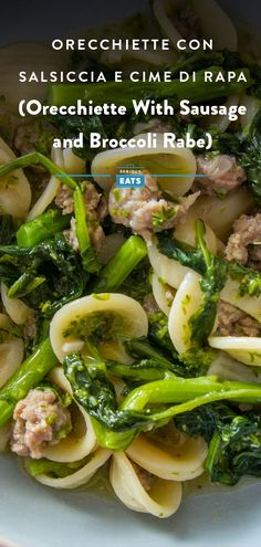 pasta with sausage and broccoli rabe in a white bowl on a table