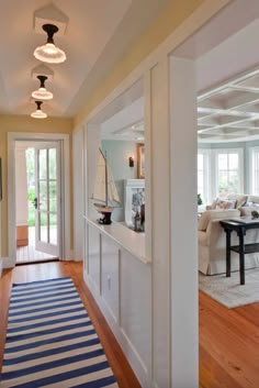 the hallway is clean and ready for guests to use it as an entrance way in this home