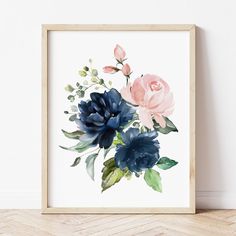 an art print with blue and pink flowers on the wall next to a wooden floor