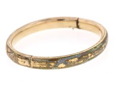 "This vintage hinged yellow gold filled bangle features a beautiful hand engraved floral and geometric design over the front half. The front has a monogram of what looks to be \"E M\". The back is plain. The bangle has been very well loved with some significant wear to the gold fill. The color is a rich buttery yellow gold. There is a push button hinged clasp that snaps closed tightly. The inner circumference is 7 inches and 8.25mm wide. The inside diameter is 2.4 inches. If the initials E and M Heirloom Gold Hinged Bracelets, Gold Victorian Hinged Bangle, Victorian Gold Hinged Bangle, Heirloom Gold Hinged Bracelet, Adjustable Hinged Gold Bangle, Antique Gold Stamped Bracelets, Antique Gold Bracelets Stamped, Antique Gold Hinged Cuff Bracelet, Antique Gold Bracelets With Stamped Details