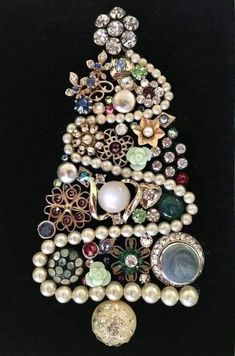 a christmas tree made out of pearls and brooches