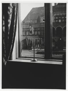 a menorah sitting in front of a window