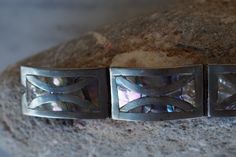 "This is a lovely luminous abalone sterling silver inlay bracelet. Smooth and comfortable to wear. Secure clasp. 6 3/4\" in circumference. 29.4 grams" Luxury Sterling Silver Inlay Bracelet As Gift, Sterling Silver Cuff Bracelet, Vintage Navajo, Sterling Silver Cuff, Silver Cuff Bracelet, Sterling Silver Bracelet, Art Deco Design, Silver Cuff, Bracelet Stack