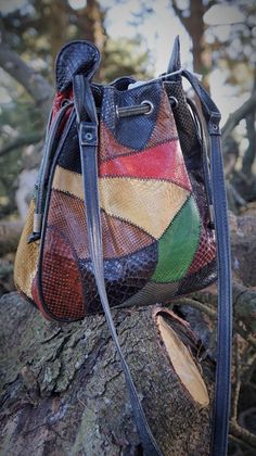 "Vintage Snake Patchwork colorful crossbody bag Really nice and in good condition (only one stain), with some signs of use but good. Vintage Snake leather from 60s. Made in Argentina Measures: - Tall: (25 cm) 9.84\" - W: (27 cm) 10.62\" - Deep: (8 cm) 3.14\"\" - Handles: 36.61\" (93 cm) Thanks for stopping by!!" Retro Multicolor Crossbody Bags, Vintage Multicolor Satchel With Removable Pouch, Multicolor Leather Bucket Bag, Multicolor Leather Pouch Bag, Multicolor Leather Pouch Shoulder Bag, Multicolor Satchel Bucket Bag, Multicolor Leather Crossbody Bucket Bag, Retro Multicolor Shoulder Bag With Phone Holder, Multicolor Retro Satchel For Everyday Use